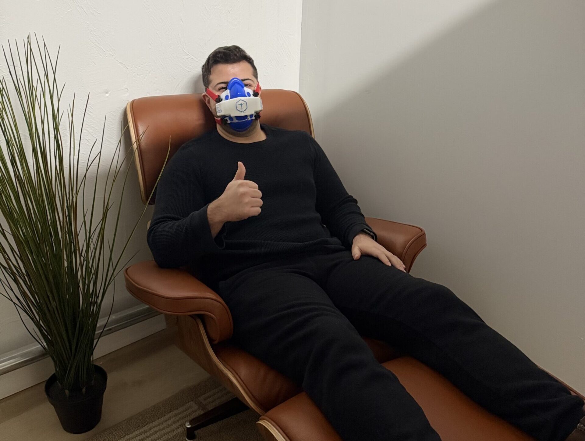 Client giving a thumbs up after completing their RMR test at BodyStats