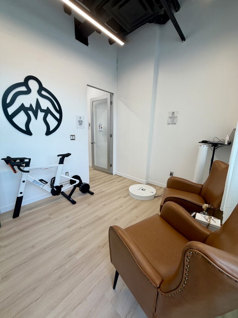 Testing room with a bike and chairs at BodyStats Toronto
