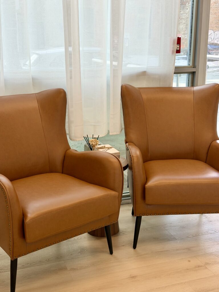 Two leather waiting chairs at BodyStats Toronto