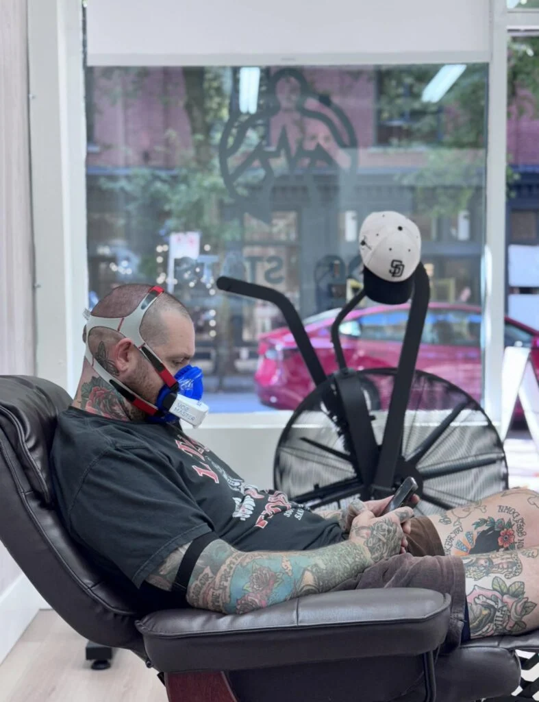 Client relaxing in a recliner during a resting metabolic rate test