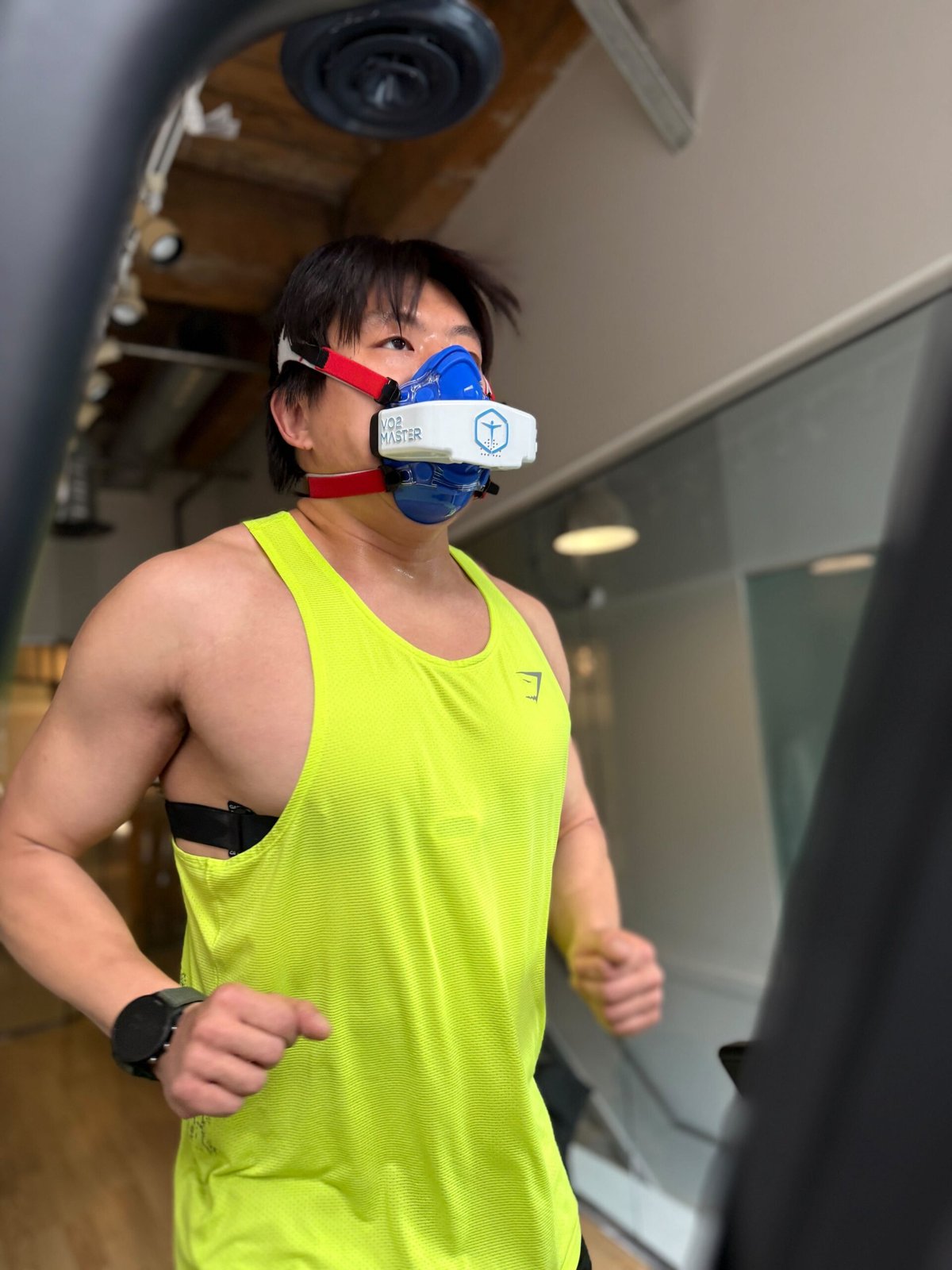 Person doing a VO2 max test on a treadmill at BodyStats with VO2 Master mask