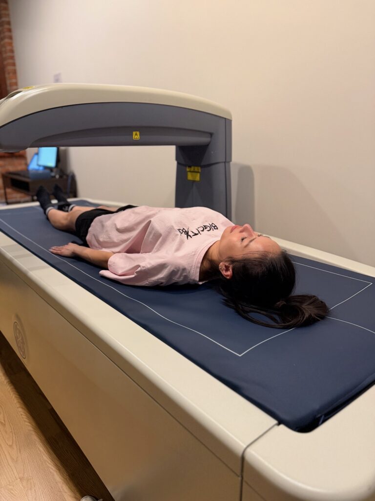 Client lying on the GE Lunar Prodigy DEXA scanner at BodyStats Yaletown